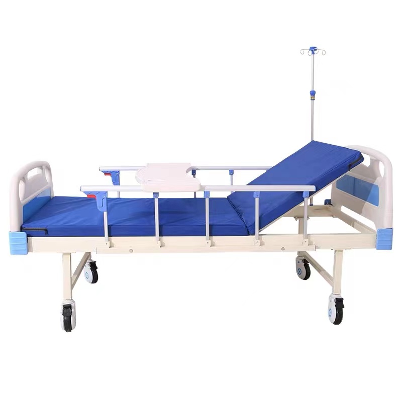 Cama de hospital de ABS de función única + colchón + barandilla + tabla de comedor + ruedas + soporte para infusiones